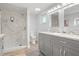 Bright bathroom features marble shower, dual sink vanity, and modern fixtures at 3810 Harrelson Rd, Lakeland, FL 33810