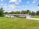 Charming one-story home with mature landscaping and a well-manicured front lawn at 3810 Harrelson Rd, Lakeland, FL 33810