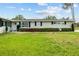 Charming home with manicured lawn, lush landscaping, and welcoming entrance at 3810 Harrelson Rd, Lakeland, FL 33810