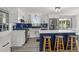 Renovated kitchen features white cabinets, a blue backsplash, and modern appliances at 3810 Harrelson Rd, Lakeland, FL 33810