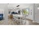 Spacious eat-in kitchen with hardwood floors, modern lighting, and barstool seating at 3810 Harrelson Rd, Lakeland, FL 33810