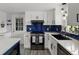 Updated kitchen with a gray stove, white cabinets, and a dark blue tile backsplash at 3810 Harrelson Rd, Lakeland, FL 33810