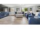 Bright living room showcasing modern decor, light wood floors, and comfortable seating arrangements at 3810 Harrelson Rd, Lakeland, FL 33810