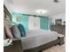 Main bedroom showcasing barn doors, a neutral palette, and ample space for relaxation at 3810 Harrelson Rd, Lakeland, FL 33810