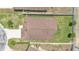Drone shot displays the house's roof, yard, and placement within a neighborhood at 420 Sir Phillips Dr, Davenport, FL 33837