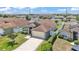 Overhead view of a suburban home featuring a two-car garage and well-kept landscaping at 420 Sir Phillips Dr, Davenport, FL 33837