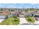 Aerial view of the home with a manicured front lawn and neighborhood setting at 420 Sir Phillips Dr, Davenport, FL 33837