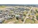 Community aerial shows a large number of homes and some commercial development nearby at 420 Sir Phillips Dr, Davenport, FL 33837