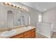 Well-lit bathroom featuring a double sink vanity, and a framed glass shower at 420 Sir Phillips Dr, Davenport, FL 33837