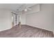 Spacious bedroom featuring wood-look flooring, neutral paint, a barn door, and ample natural light at 420 Sir Phillips Dr, Davenport, FL 33837