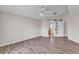 Neutral bedroom with wood-look flooring, ample light, and a closet for optimal storage solutions at 420 Sir Phillips Dr, Davenport, FL 33837