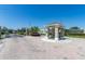 Regency Place gated community entrance showcasing a well-maintained entry with lush landscaping and secure access at 420 Sir Phillips Dr, Davenport, FL 33837