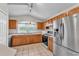 Bright kitchen with stainless steel appliances, tile flooring, and ample cabinet space at 420 Sir Phillips Dr, Davenport, FL 33837