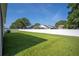 Spacious backyard featuring a well-maintained lawn and privacy fence at 4303 Moon Shadow Loop, Mulberry, FL 33860
