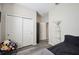 Cozy bedroom featuring gray wood-look floors and a spacious closet at 4303 Moon Shadow Loop, Mulberry, FL 33860