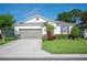 Lovely single-story home with a well-kept lawn and two-car garage at 4303 Moon Shadow Loop, Mulberry, FL 33860