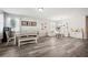 Bright, open-concept living room featuring neutral tones, hardwood floors, and stylish furnishings at 4303 Moon Shadow Loop, Mulberry, FL 33860