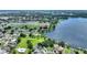 Breathtaking aerial view of the community, highlighting the stunning lakefront property and lush green landscape at 440 Lake Daisy, Winter Haven, FL 33884