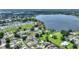 Picturesque aerial view showcasing the community's proximity to the lake and featuring lush green landscaping at 440 Lake Daisy, Winter Haven, FL 33884