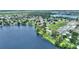 Stunning aerial view showcasing a lakeside community with lush landscaping and a serene waterfront setting at 440 Lake Daisy, Winter Haven, FL 33884