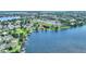 Aerial view shows community with waterfront properties and private docks on a lake at 440 Lake Daisy, Winter Haven, FL 33884