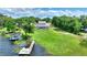 Aerial view of a home with a backyard, swimming pool and dock on the lake at 440 Lake Daisy, Winter Haven, FL 33884