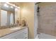 Bathroom featuring granite vanity with an oval sink, and a shower with decorative tile surround at 440 Lake Daisy, Winter Haven, FL 33884