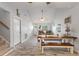 Open dining space features a large table with kitchen access and wood-look floors at 440 Lake Daisy, Winter Haven, FL 33884