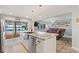 Kitchen island with sink overlooking the pool and lake at 440 Lake Daisy, Winter Haven, FL 33884