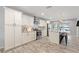 Updated kitchen featuring white cabinets, stainless appliances, and island with breakfast bar at 440 Lake Daisy, Winter Haven, FL 33884