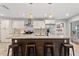 Kitchen island featuring breakfast bar, stainless appliances, and pendant lighting at 440 Lake Daisy, Winter Haven, FL 33884