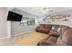 Bright living room with large window and comfortable seating at 440 Lake Daisy, Winter Haven, FL 33884