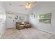 Inviting living room features wood-look flooring, natural light, and cozy seating at 440 Lake Daisy, Winter Haven, FL 33884