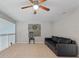 Spacious loft area with carpet flooring, sofa, and mounted wall art at 440 Lake Daisy, Winter Haven, FL 33884