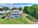 Aerial view showcasing a screened-in pool and lush backyard at 440 Lake Daisy, Winter Haven, FL 33884