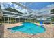 Beautiful backyard features screened pool, patio, and stunning waterfront views of the lake at 440 Lake Daisy, Winter Haven, FL 33884