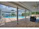 Spacious, screened patio with a pool and waterfront views on the lake, perfect for entertaining at 440 Lake Daisy, Winter Haven, FL 33884
