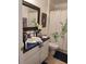 Clean and functional bathroom with a vanity, mirror, and shower, designed for everyday convenience at 455 Eagle Dr, Kissimmee, FL 34759