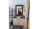 Bright bathroom featuring a sink with vanity, storage cabinet, and decorative mirror at 455 Eagle Dr, Kissimmee, FL 34759
