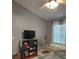 Relaxing bedroom featuring neutral colors, a window, and comfortable seating at 455 Eagle Dr, Kissimmee, FL 34759