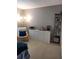 Cozy bedroom with dresser, shelving unit, and chair at 455 Eagle Dr, Kissimmee, FL 34759