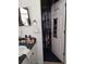 Bathroom view showing the closet with rods, shelving, and storage solutions at 455 Eagle Dr, Kissimmee, FL 34759