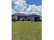 Charming single-story home with well-manicured lawn and ample garage parking at 455 Eagle Dr, Kissimmee, FL 34759