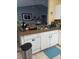 A well-equipped kitchen with white cabinets and an island sink area at 455 Eagle Dr, Kissimmee, FL 34759