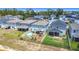 Aerial view of fenced backyard with above ground pool, patio, and play structure at 511 Preserve Pointe Blvd, Davenport, FL 33837