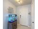 Welcoming foyer with stylish light fixture and a charming aquarium at 511 Preserve Pointe Blvd, Davenport, FL 33837