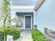 Inviting front porch with hanging chair and lush landscaping for a welcoming entrance at 511 Preserve Pointe Blvd, Davenport, FL 33837