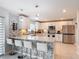 Modern kitchen with stainless steel appliances and counter seating at 511 Preserve Pointe Blvd, Davenport, FL 33837