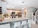 Bright kitchen featuring granite countertops, stainless steel appliances and a stylish backsplash at 511 Preserve Pointe Blvd, Davenport, FL 33837