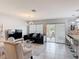 Stylish living room featuring a modern sofa and sliding glass doors to the outdoor area at 511 Preserve Pointe Blvd, Davenport, FL 33837